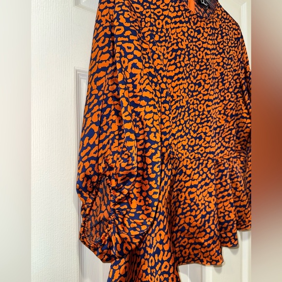 LULUS Color Me Wild Orange and Navy Blue Leopard Print Peplum Top size M. NWOT - Picture 3 of 12